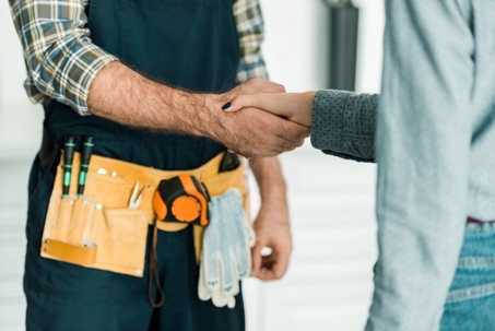 contractor and homeowner shaking hands
