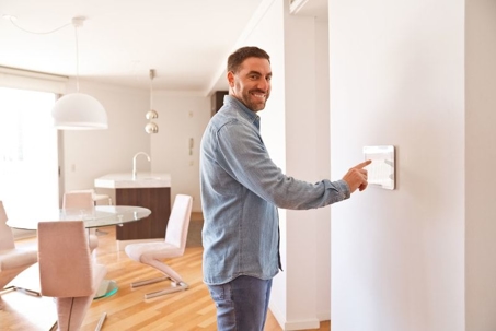 man with thermostat