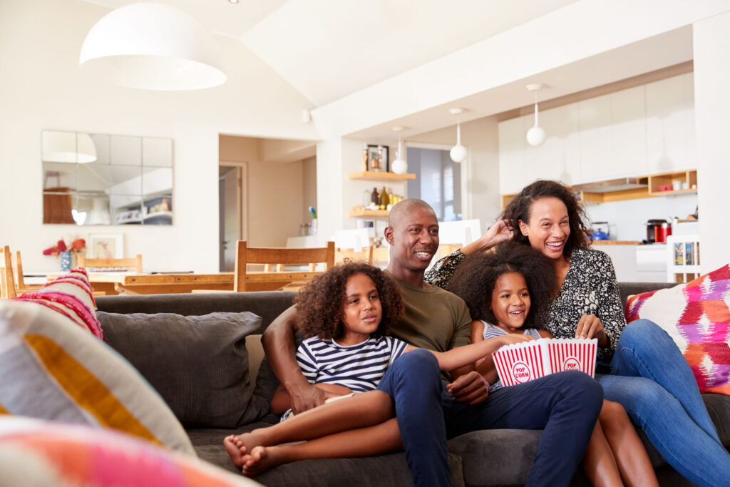 Family Watching Movie Together In Norfolk, Virginia Home